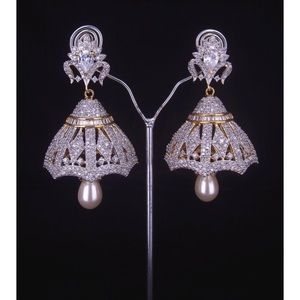 Beautiful silver and gold earrings with stones.